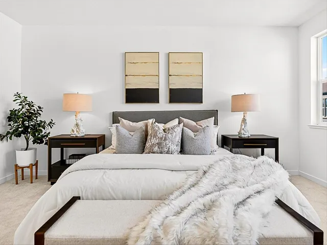 a bedroom with furniture and a bed