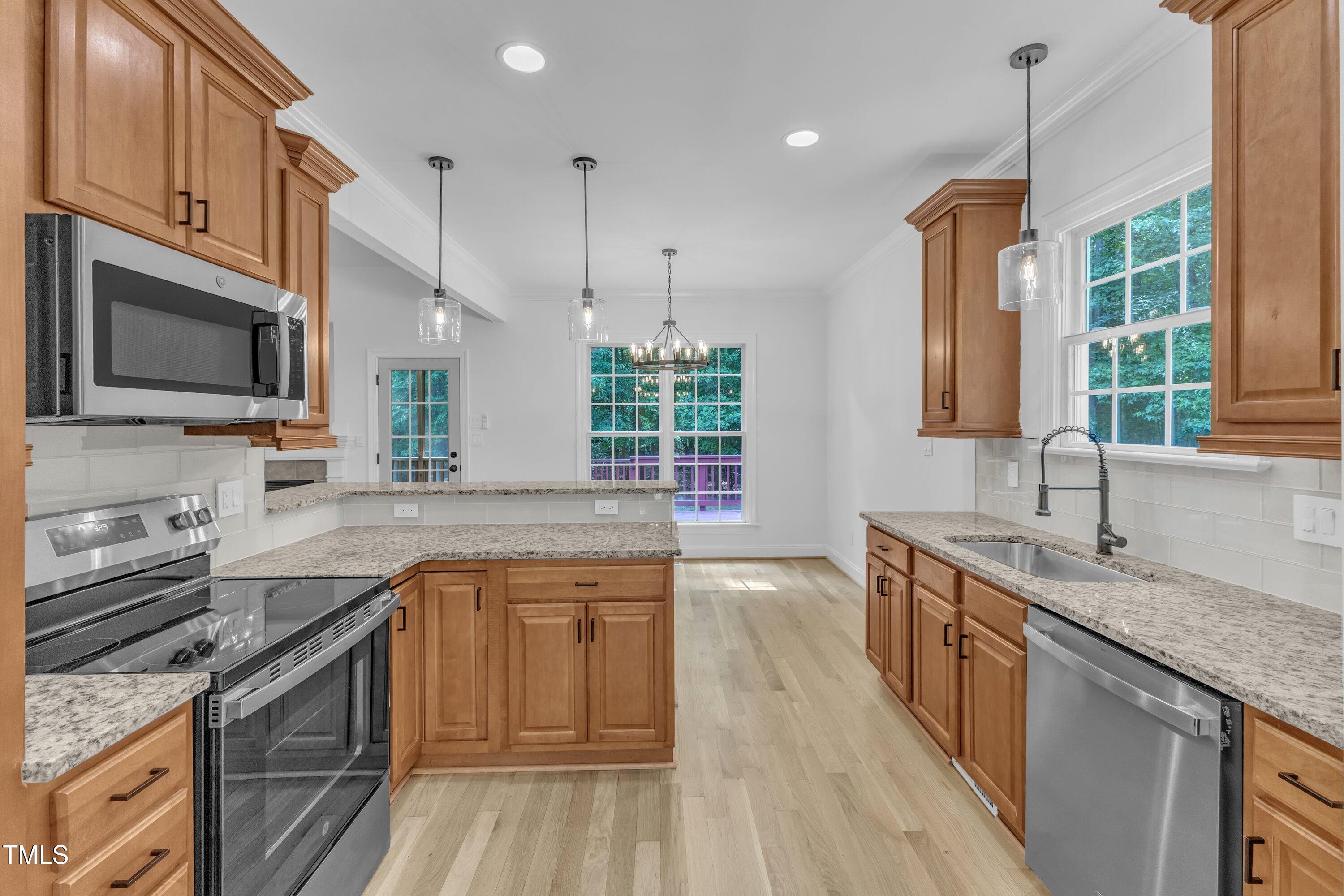 2103 Troys Trail Franklinton, NC 27525 - Photo 1 of 53 a kitchen with a sink stove top oven and refrigerator