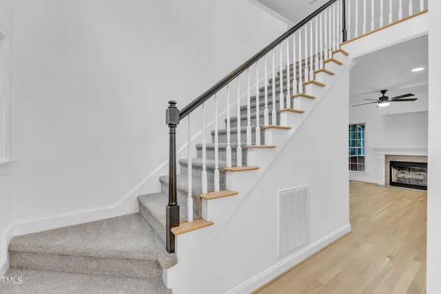 a bath room with a toilet and a bath tub
