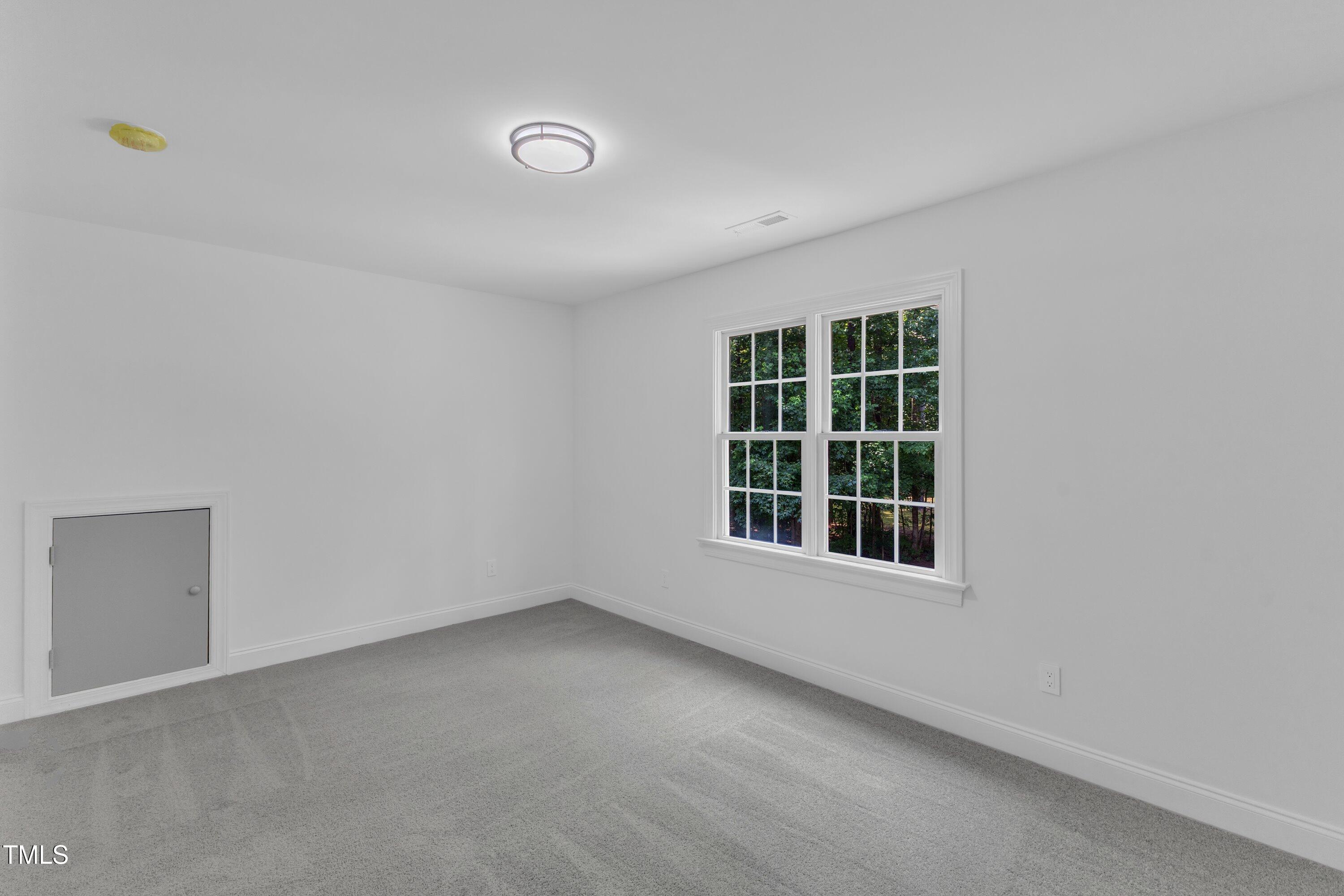 2103 Troys Trail Franklinton, NC 27525 - Photo 28 of 53 an empty room with a window