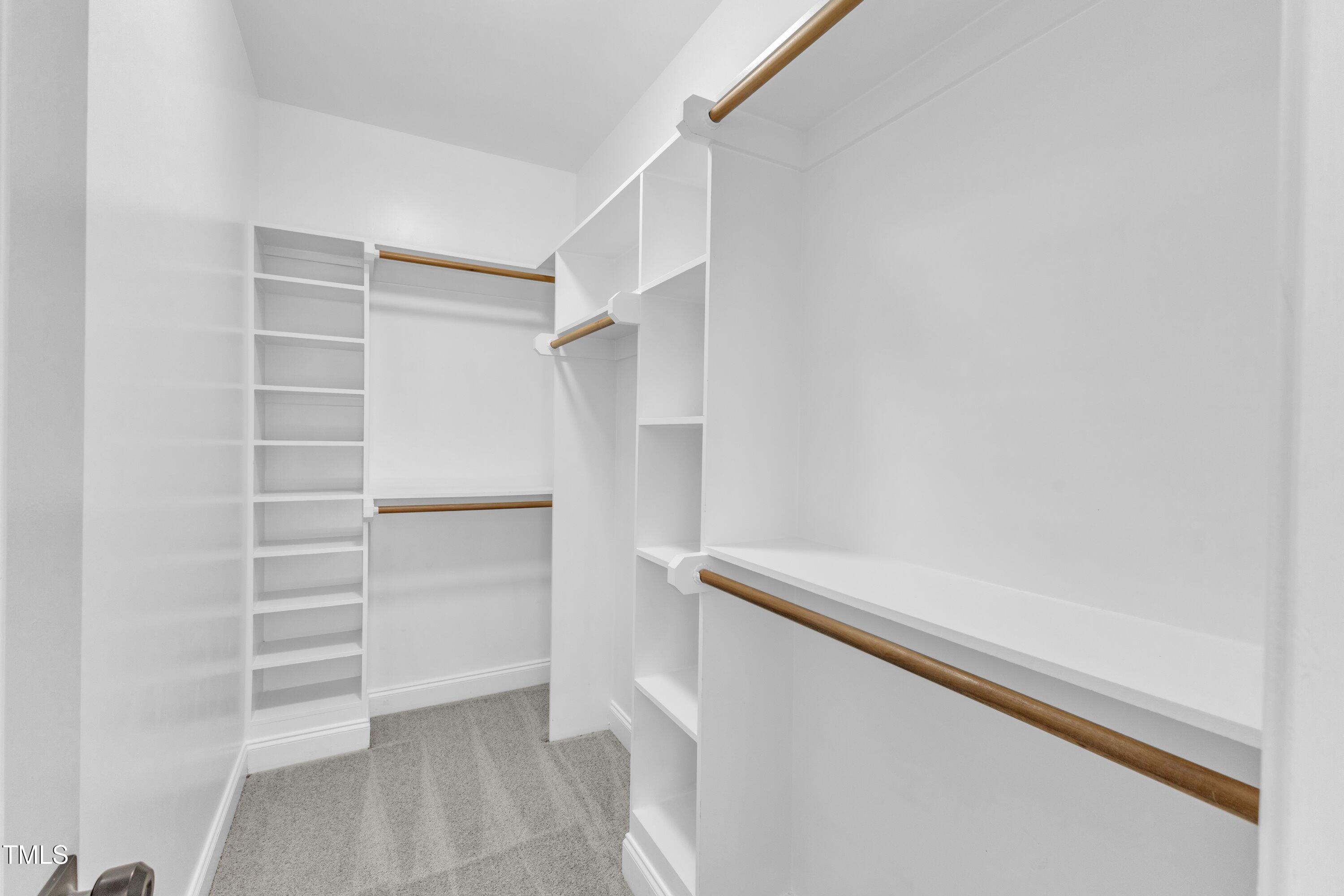 2103 Troys Trail Franklinton, NC 27525 - Photo 36 of 53 a view of walk in closet with empty racks