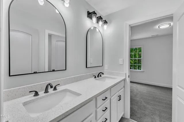 a kitchen with stainless steel appliances granite countertop a refrigerator a stove top oven a sink and dishwasher