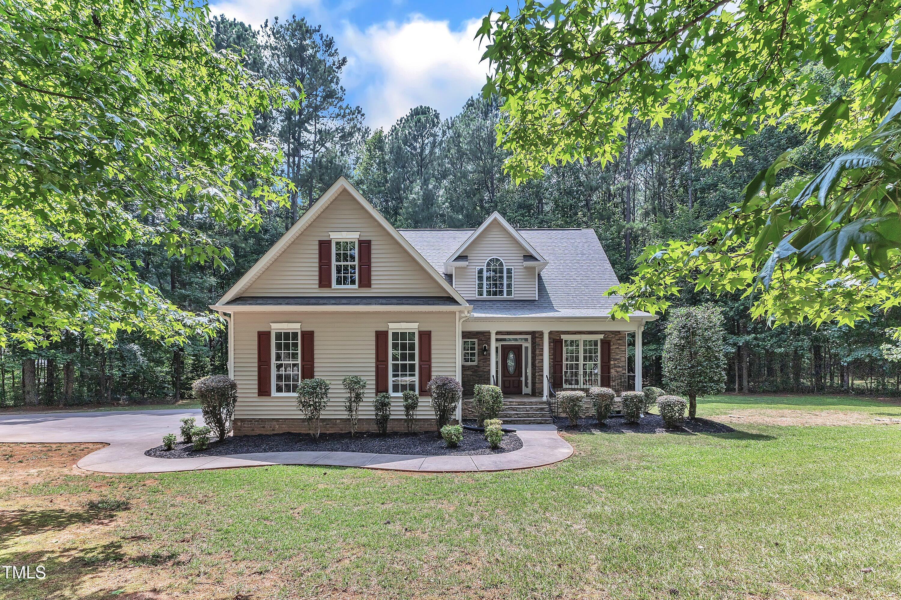 2103 Troys Trail Franklinton, NC 27525 - Photo 53 of 53 a front view of a house with swimming pool and porch