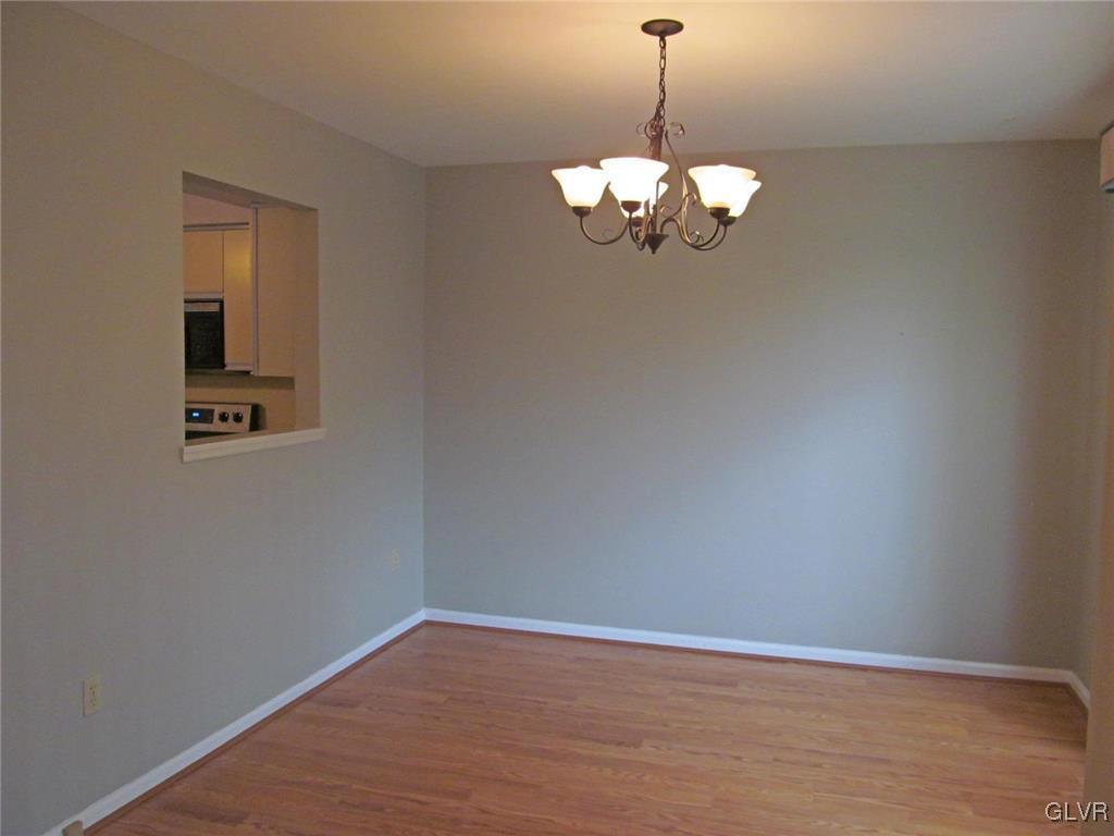 1201 Butztown Road, Unit 22 Bethlehem, PA 18017 - Photo 12 of 23 a view of a chandelier fan and hardwood floor