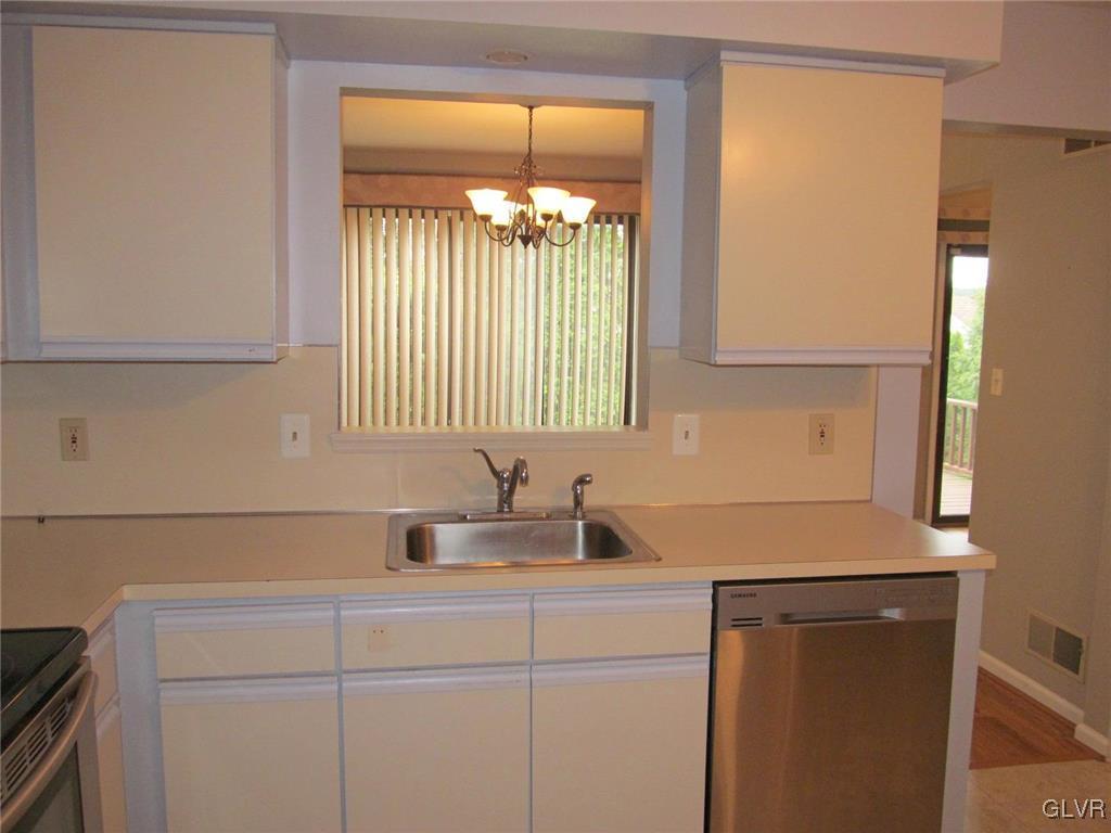 1201 Butztown Road, Unit 22 Bethlehem, PA 18017 - Photo 14 of 23 a kitchen with a sink and large cabinets
