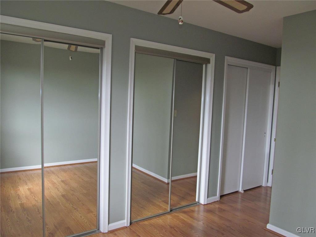 1201 Butztown Road, Unit 22 Bethlehem, PA 18017 - Photo 20 of 23 a view of an empty room with wooden floor