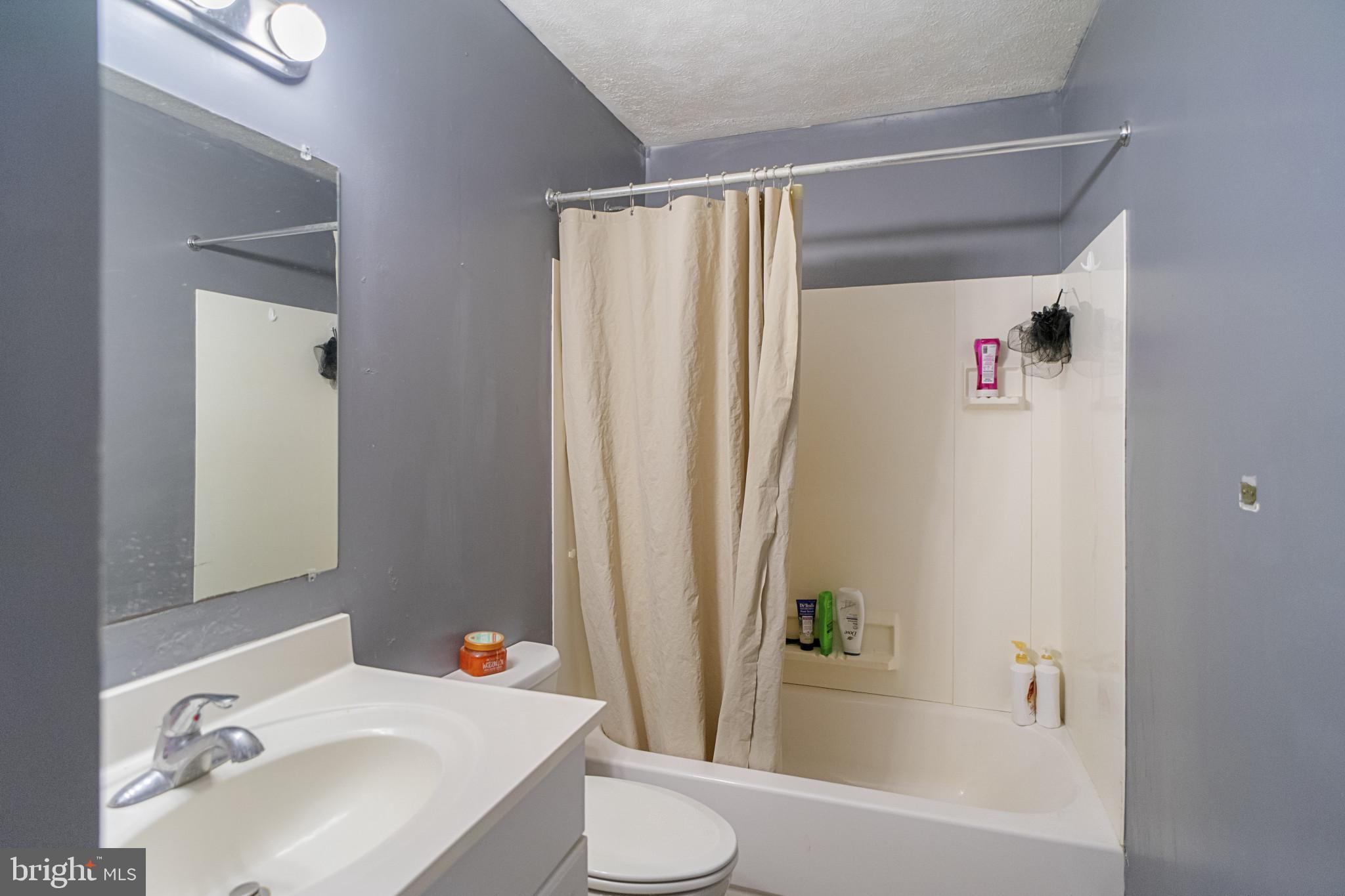 1909 Hanover Pike Hampstead, MD 21074 - Photo 10 of 32 a bathroom with a sink toilet and shower