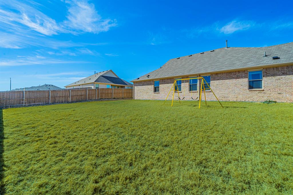 1240 Almond Road Azle, TX 76020 - Photo 23 of 26 a view of a house with a yard