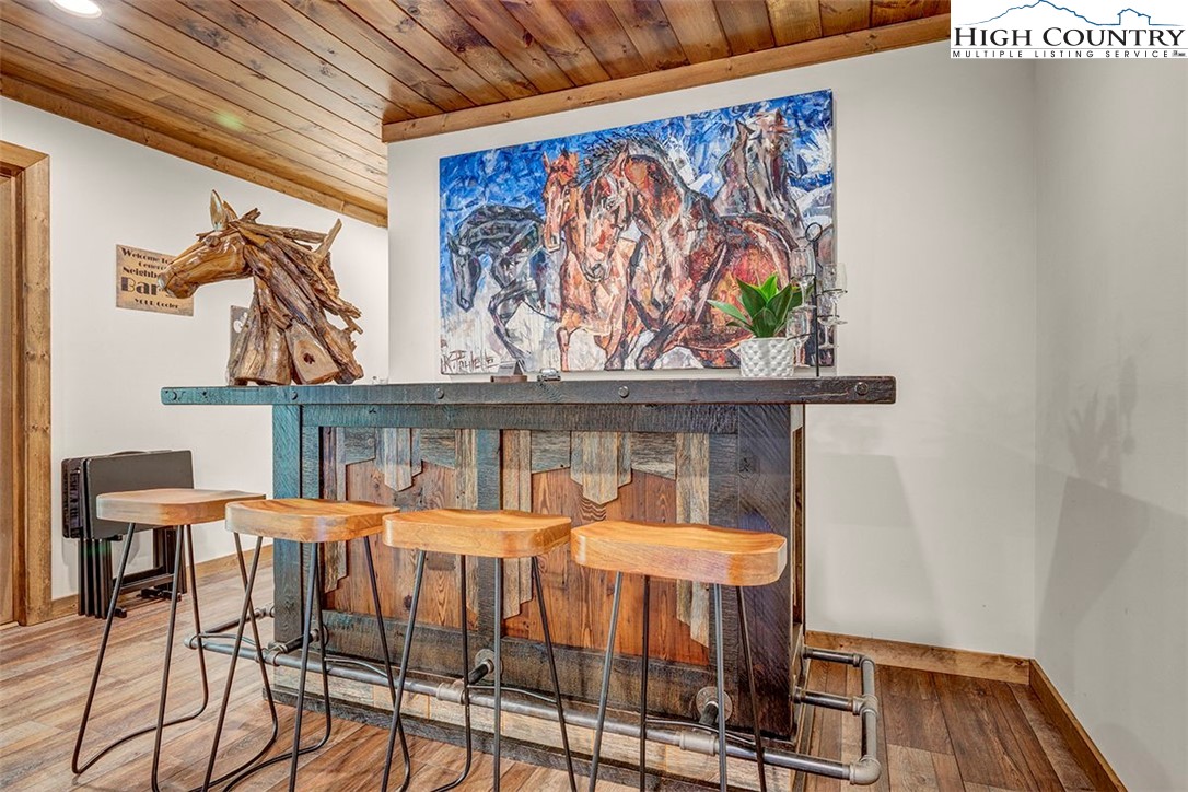 428 Cloud Spring Drive Sugar Mountain, NC 28604 - Photo 11 of 45 a bedroom with a bed and furniture