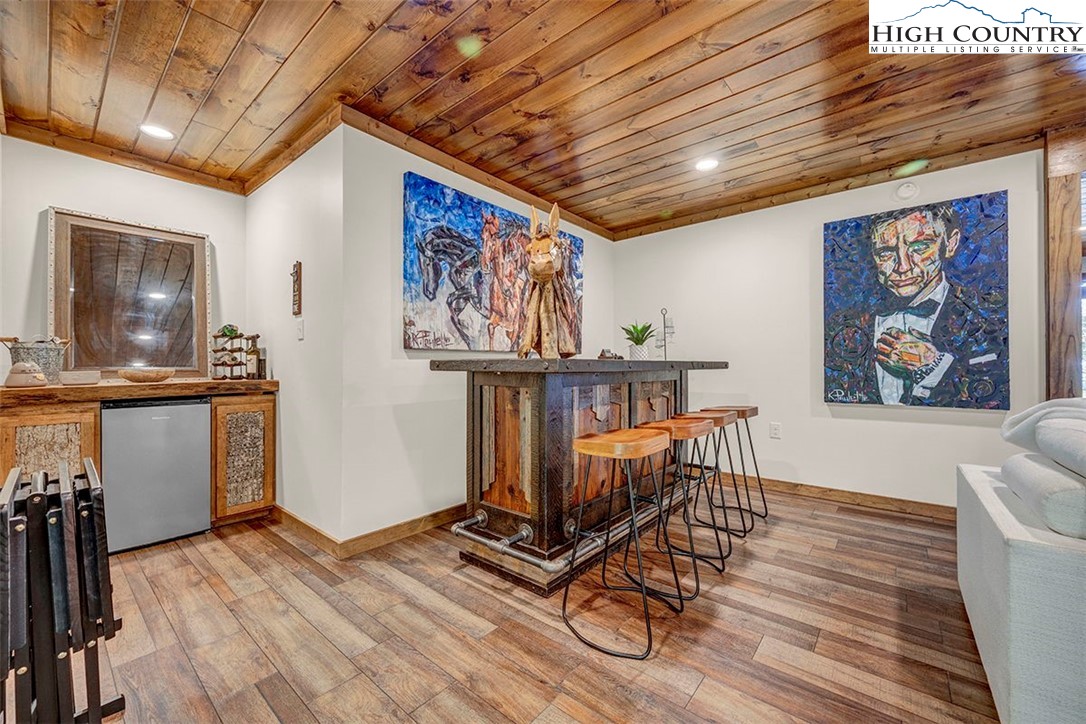 428 Cloud Spring Drive Sugar Mountain, NC 28604 - Photo 12 of 45 a view of a room with furniture wooden floor and window