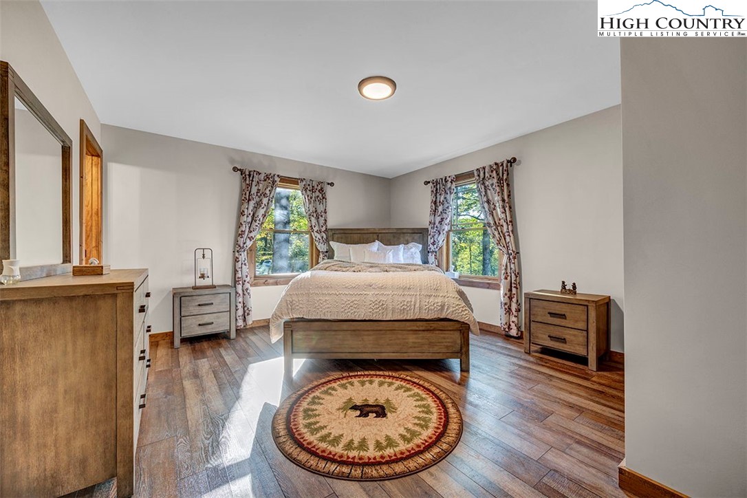 428 Cloud Spring Drive Sugar Mountain, NC 28604 - Photo 14 of 45 a bed room with a bed and a window