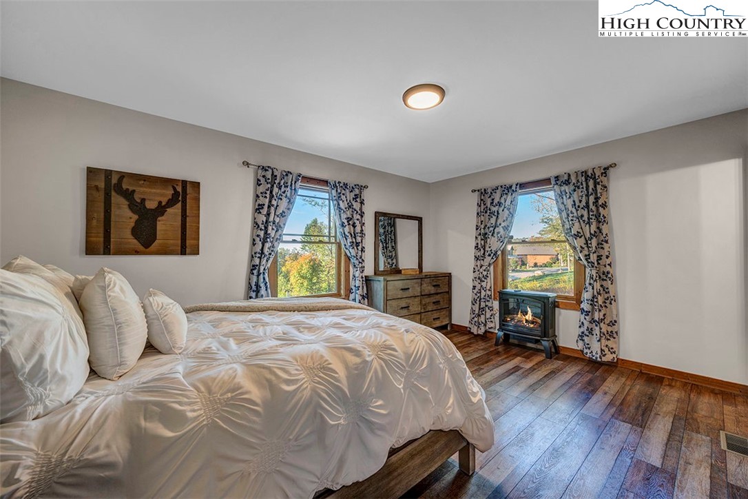 428 Cloud Spring Drive Sugar Mountain, NC 28604 - Photo 16 of 45 a bedroom with a bed and window