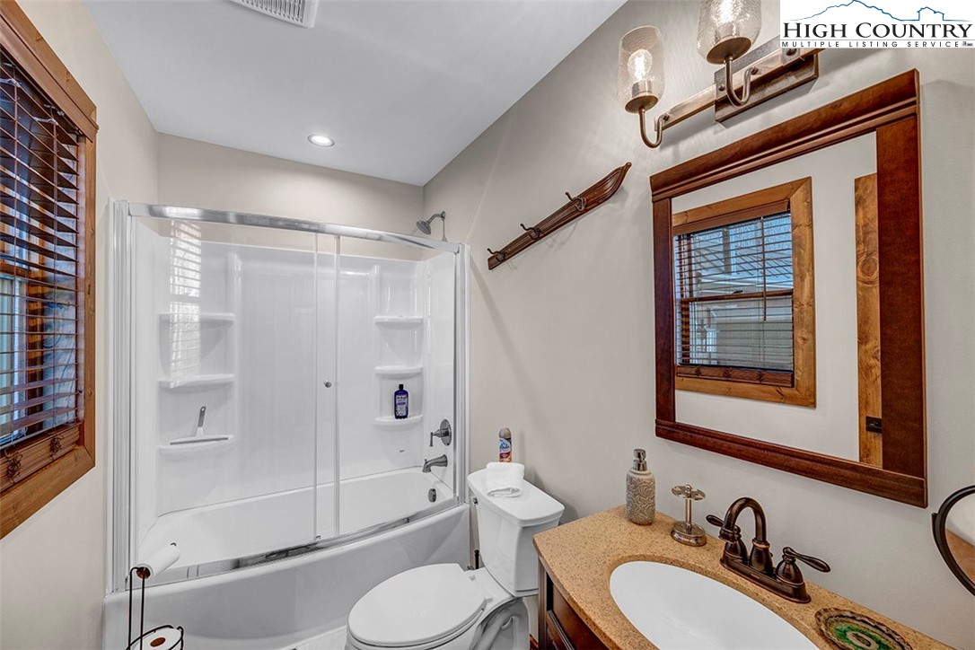 428 Cloud Spring Drive Sugar Mountain, NC 28604 - Photo 17 of 45 a bathroom with a sink a toilet and shower