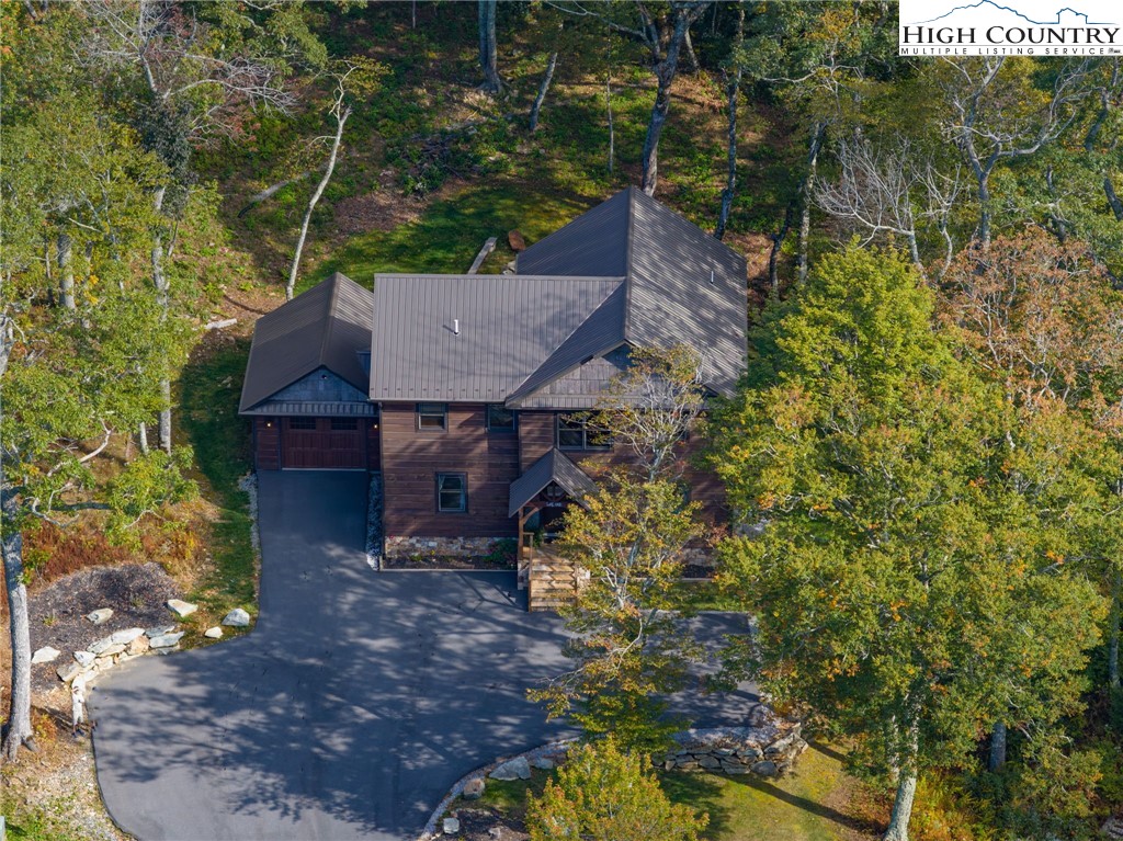 428 Cloud Spring Drive Sugar Mountain, NC 28604 - Photo 2 of 45 a view of a house with a yard and large tree
