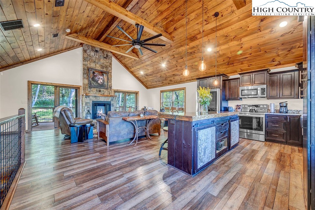 428 Cloud Spring Drive Sugar Mountain, NC 28604 - Photo 24 of 45 a living room with lots of furniture and kitchen view