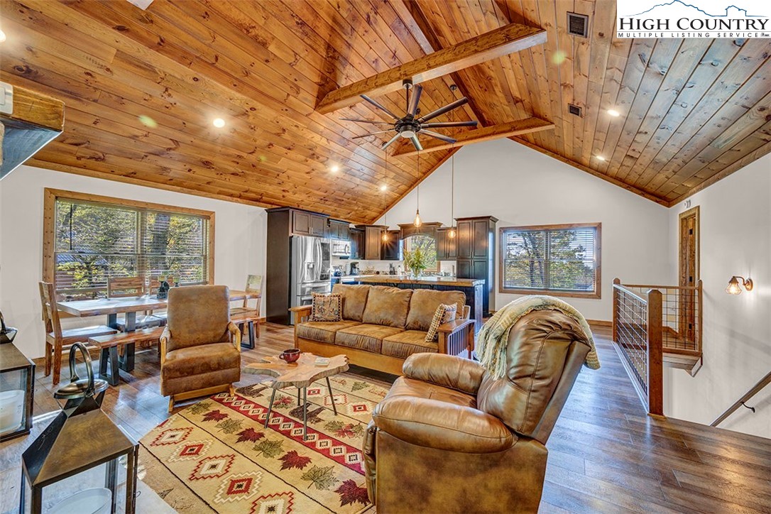 428 Cloud Spring Drive Sugar Mountain, NC 28604 - Photo 25 of 45 a living room with furniture a wooden floor and next to a window
