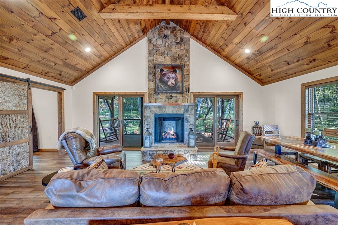 428 Cloud Spring Drive Sugar Mountain, NC 28604 - Photo 28 of 45 a living room with furniture and a fireplace