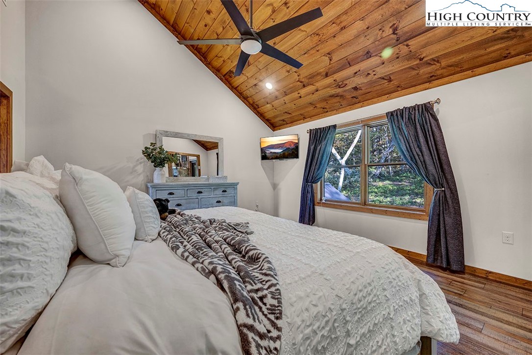 428 Cloud Spring Drive Sugar Mountain, NC 28604 - Photo 35 of 45 a bedroom with a large bed and a window