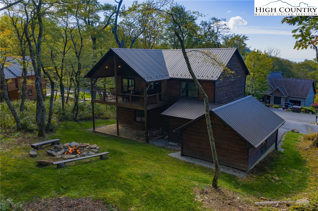 428 Cloud Spring Drive Sugar Mountain, NC 28604 - Photo 4 of 45 a view of a house with a yard and sitting area