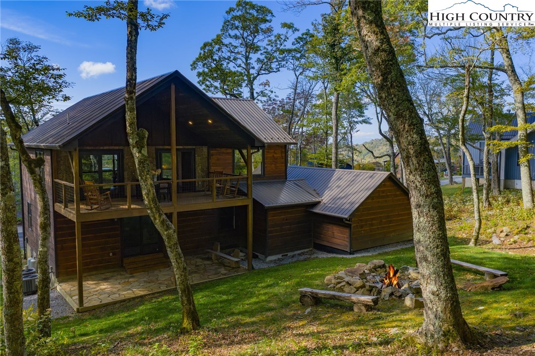428 Cloud Spring Drive Sugar Mountain, NC 28604 - Photo 5 of 45 a view of a house with a yard