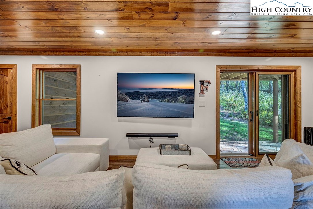 428 Cloud Spring Drive Sugar Mountain, NC 28604 - Photo 8 of 45 a bedroom with furniture and a window