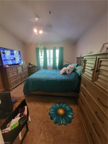 a large white kitchen with a sink a washer and dryer