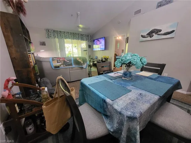 a living room with furniture a window and a table