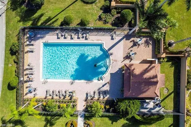 a view of swimming pool with outdoor seating