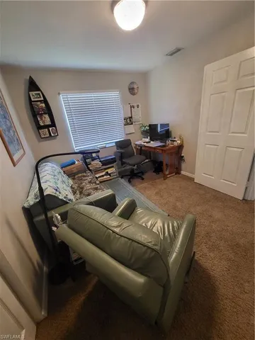 a living room with furniture and a couch