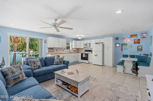 a bedroom with a bed and a wall painting