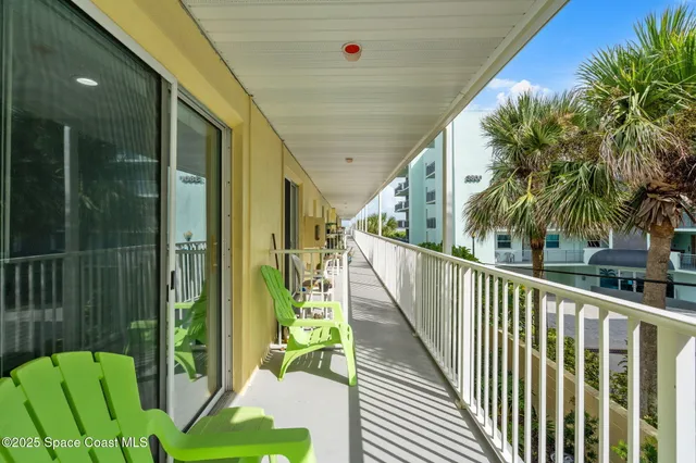 a view of balcony with wooden floor