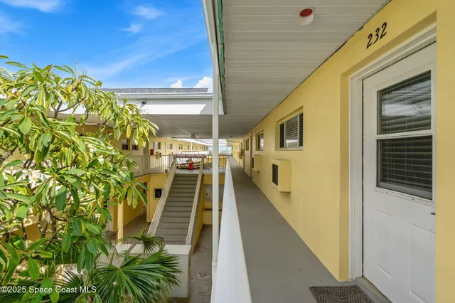 a view of a balcony with wooden floor