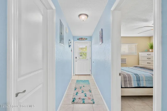 a view of bedroom with a bed and wooden floor