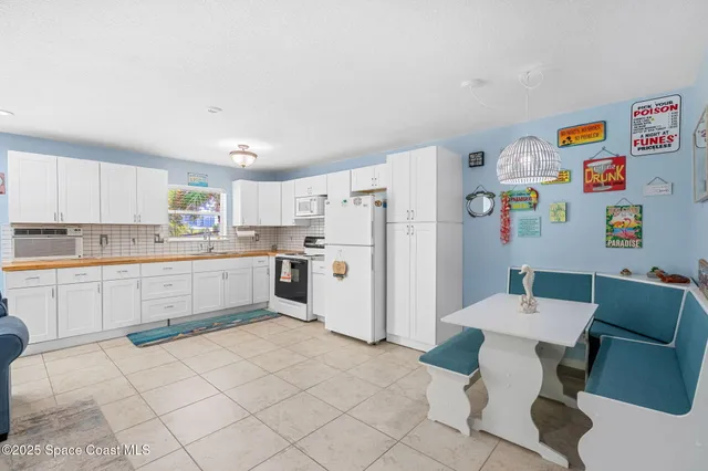 a kitchen with cabinets and stainless steel appliances