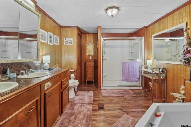 a spacious bathroom with a sink and a mirror