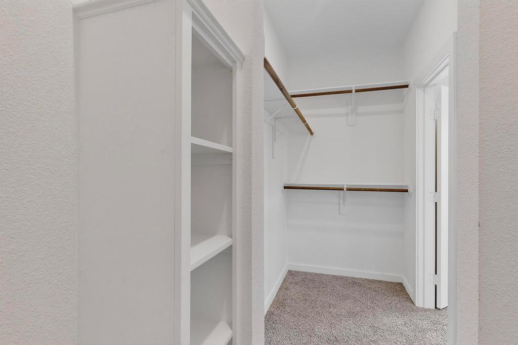 740 Section House Road Ennis, TX 75119 - Photo 16 of 31 a view of an empty walk in closet