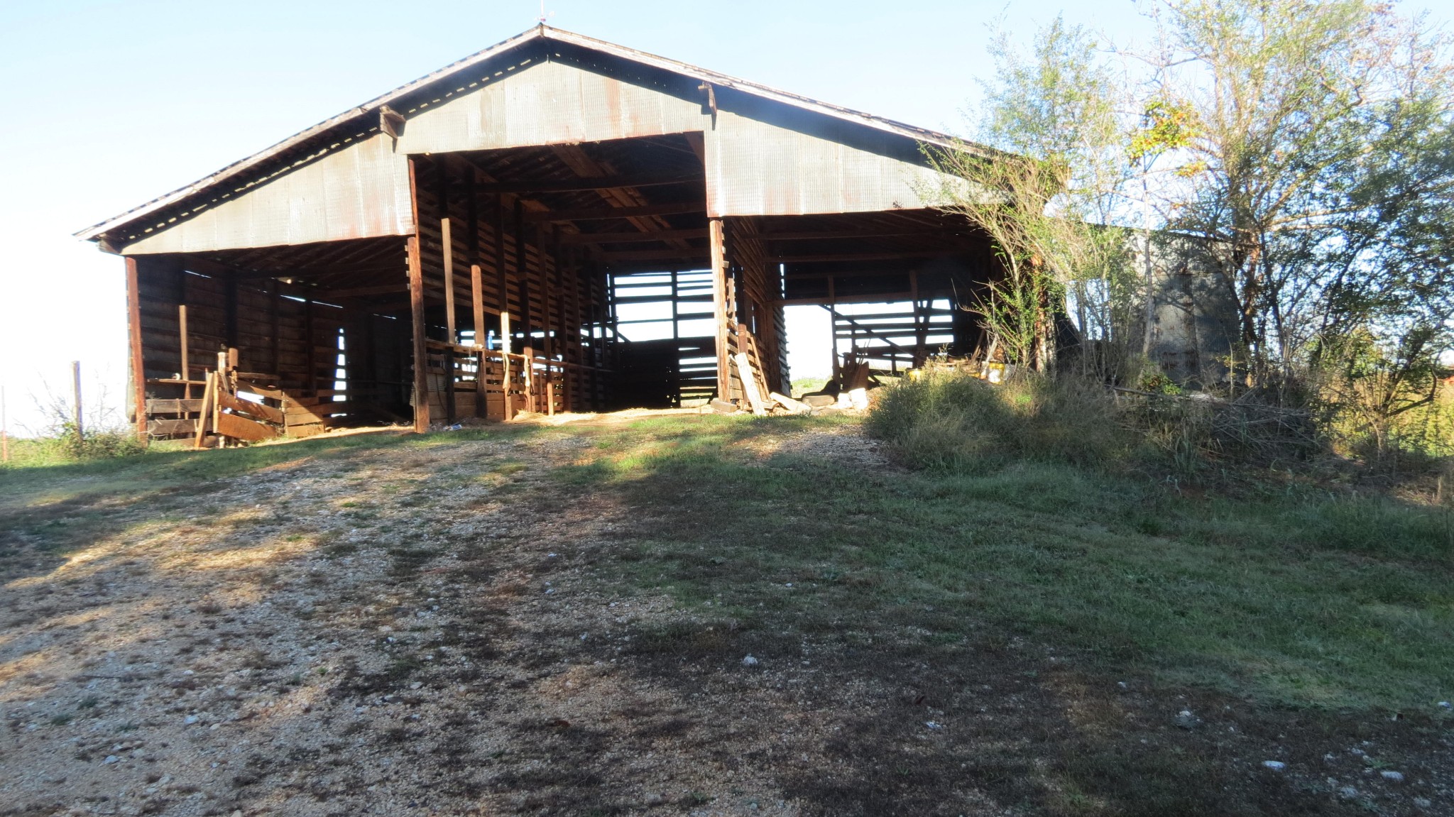 562 Roach Road Decaturville, TN 38329 - Photo 19 of 31 a view of a house with floor to ceiling windows and a basket ball poll