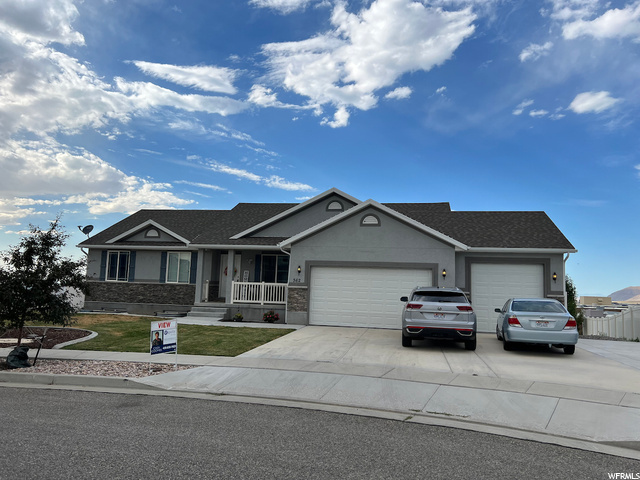 362 West 2030th Street North Tooele, UT 84074 - Photo 1 of 1 Ranch-style house featuring 3 car garage and a front yard