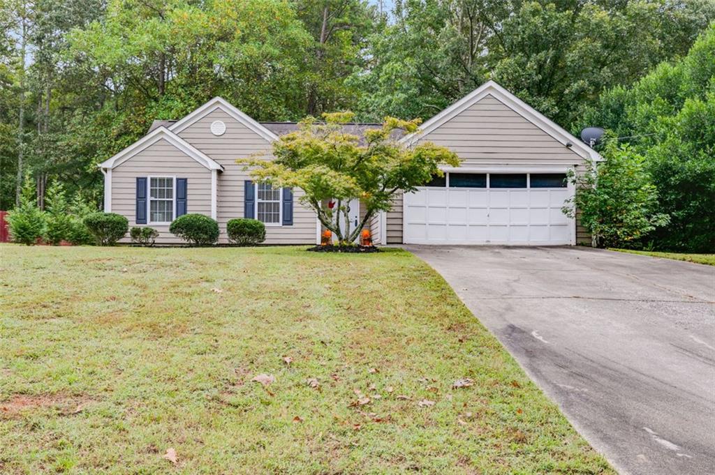 353 Springbrooke Trail Dallas, GA 30157 - Photo 1 of 1 a front view of a house with garden