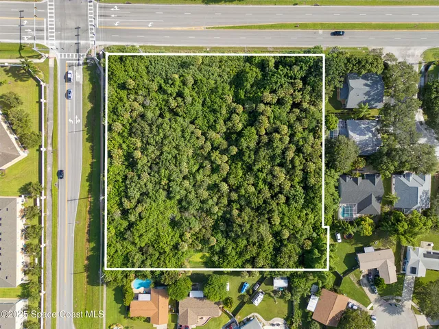 a view of a lake with a yard