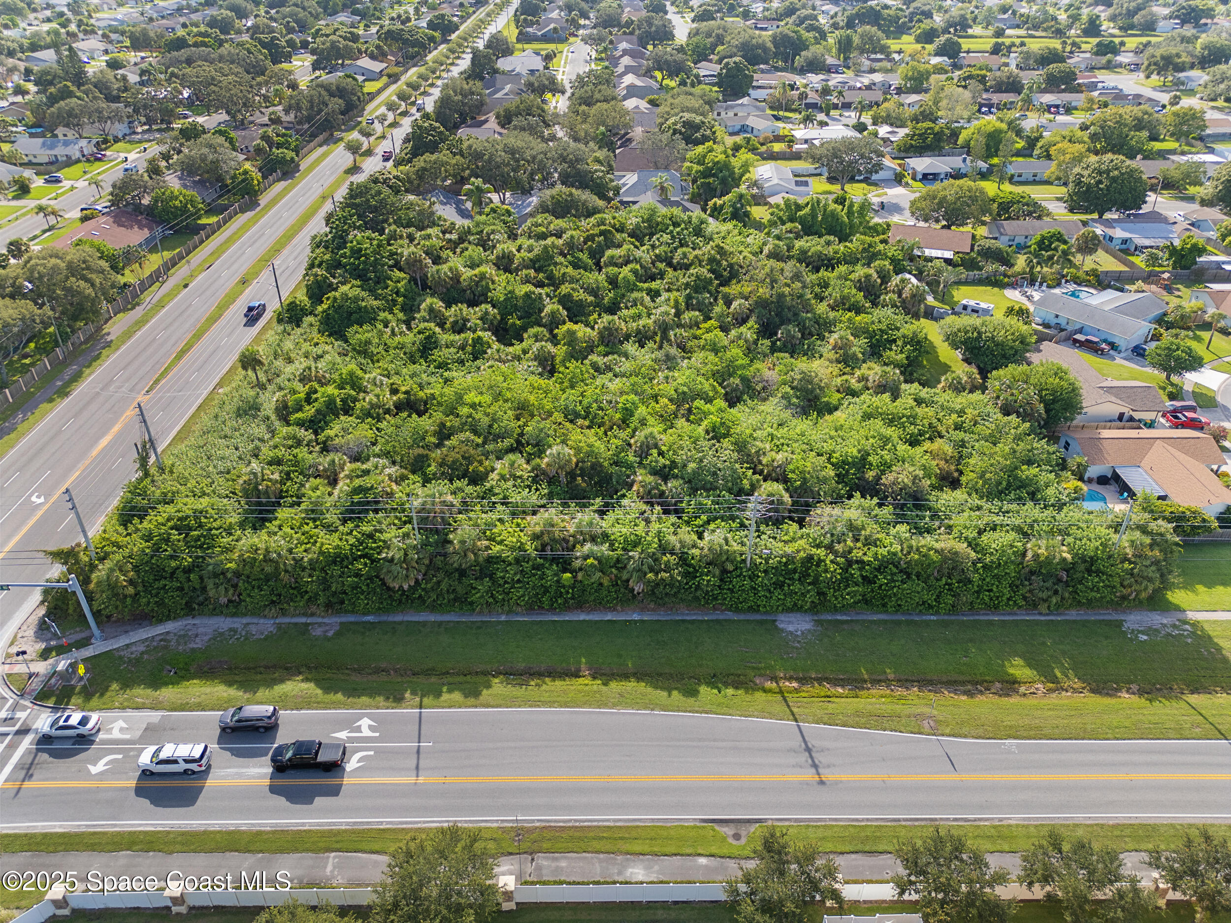 0 Lake Washington Road Melbourne, FL 32935 - Photo 7 of 8 a view of a lake with a yard