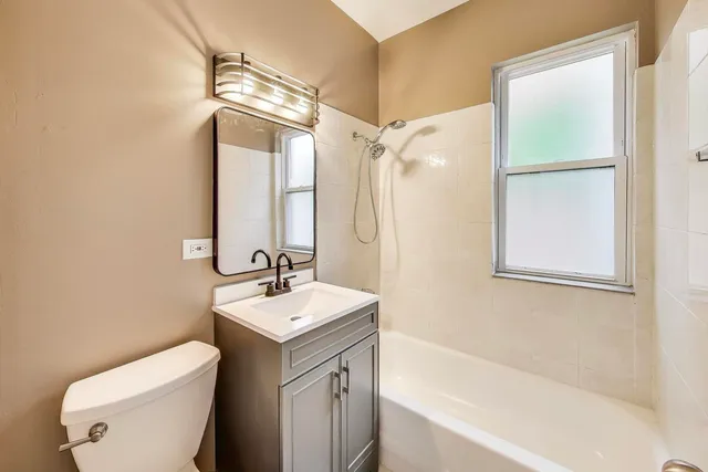 a bathroom with a sink a toilet and a bathtub