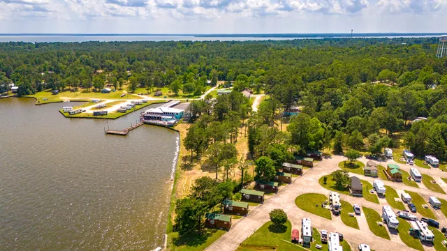 view of a lake with lawn chairs