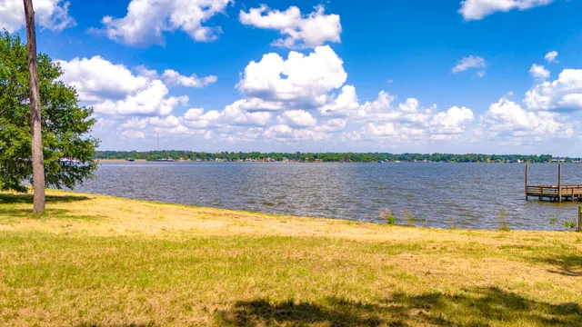 a view of a lake and sunset
