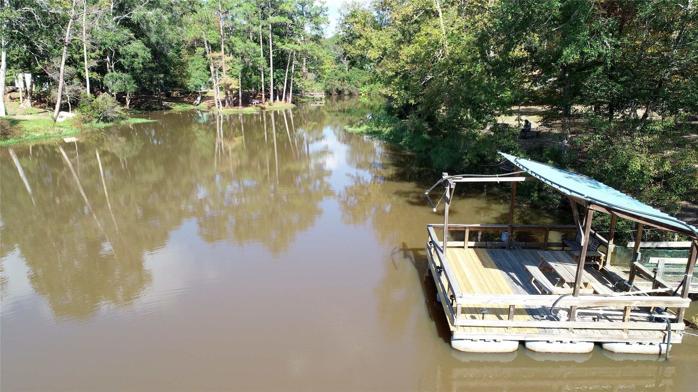 630 Hillbilly Heaven Road Livingston, TX 77351 - Photo 11 of 17 a view of swimming pool with a lake view