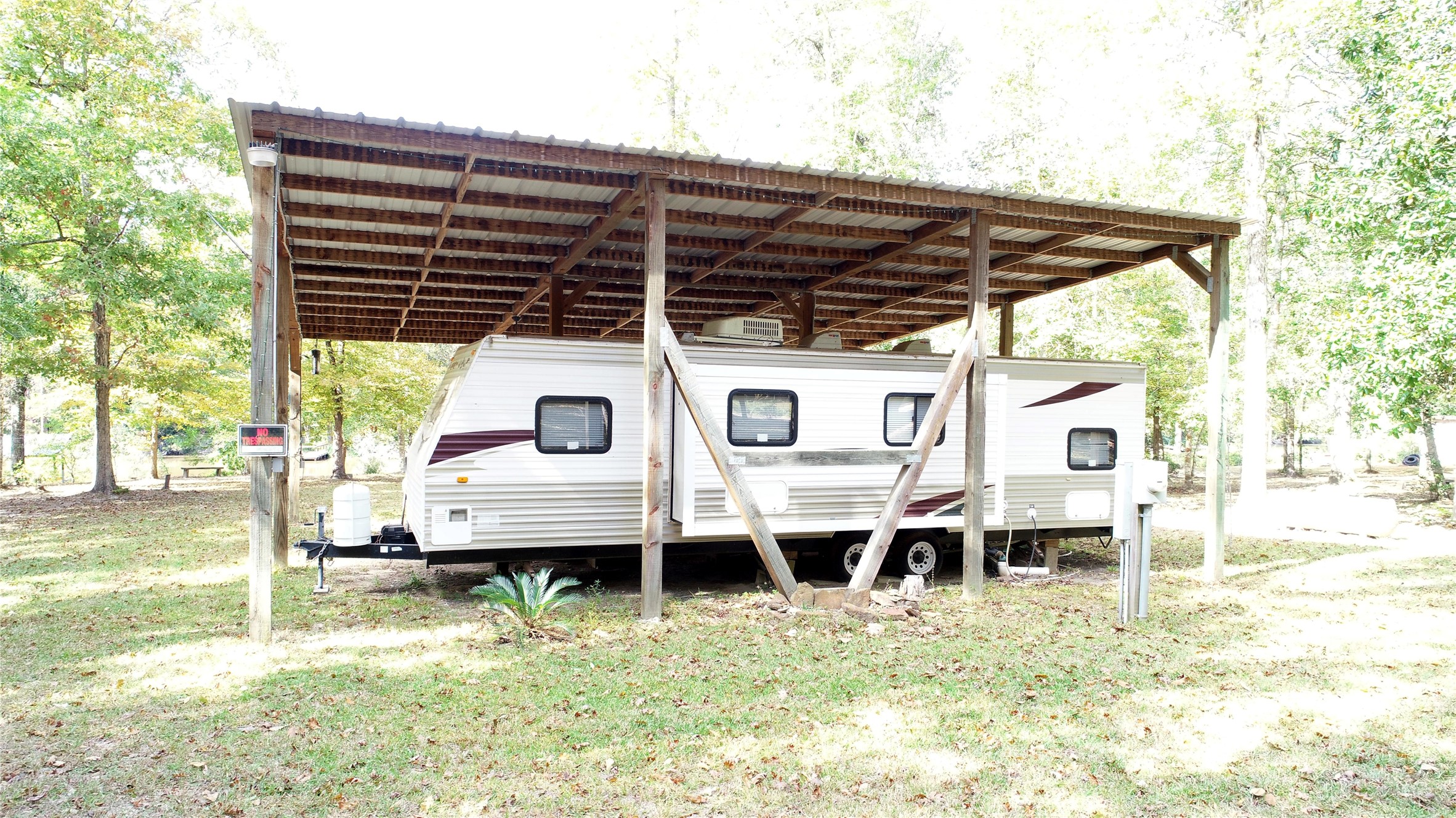 630 Hillbilly Heaven Road Livingston, TX 77351 - Photo 13 of 17 a house view with a outdoor seating space