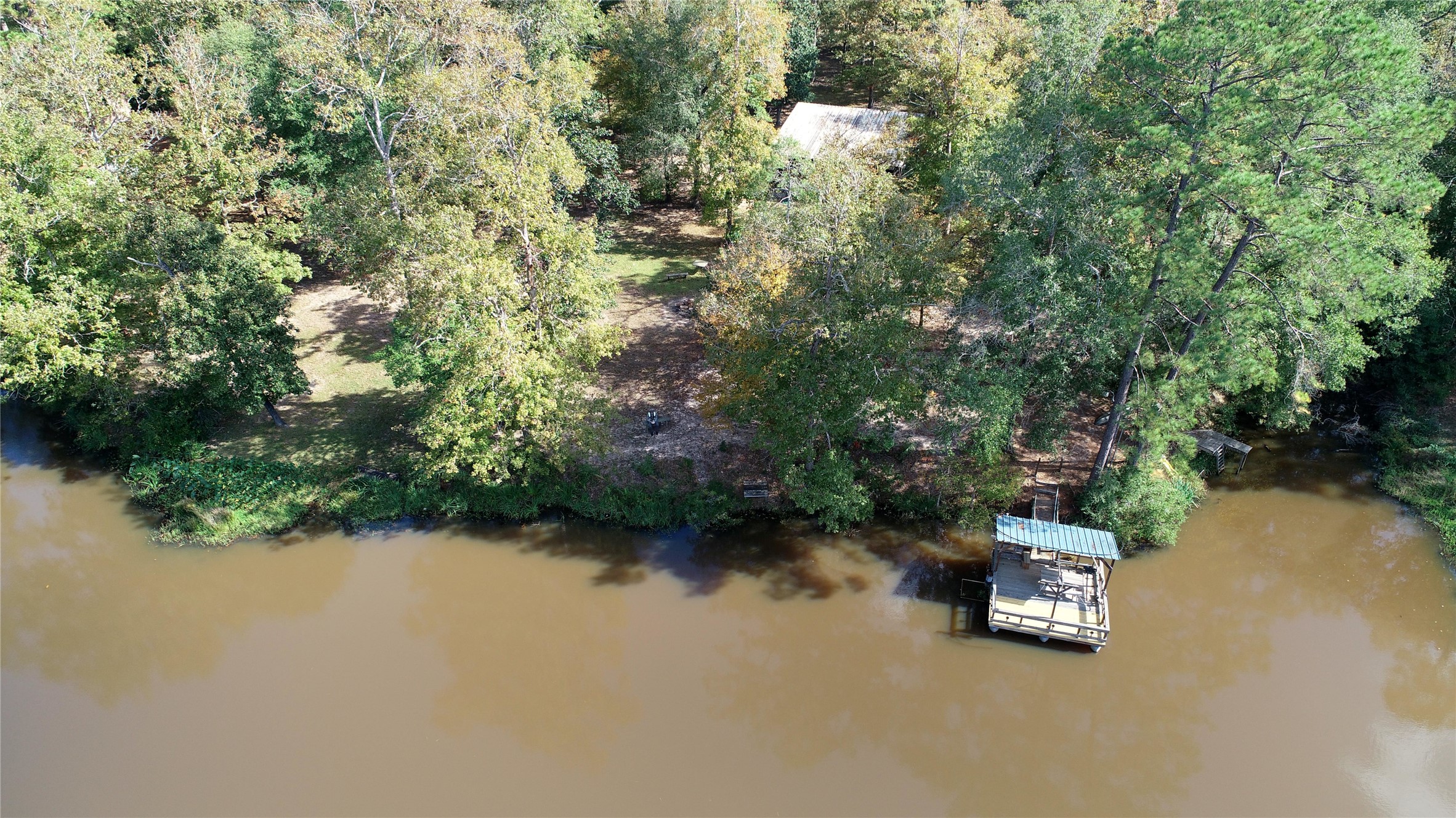 630 Hillbilly Heaven Road Livingston, TX 77351 - Photo 14 of 17 an aerial view of a house with a yard and lake view