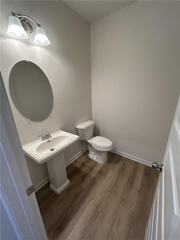 23 Whistling Oaks NE Drive Rome, GA 30165 - Photo 11 of 26 a bathroom with a sink toilet and a mirror