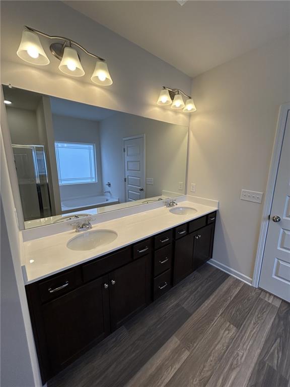 23 Whistling Oaks NE Drive Rome, GA 30165 - Photo 17 of 26 a spacious bathroom with a double vanity sink and a mirror