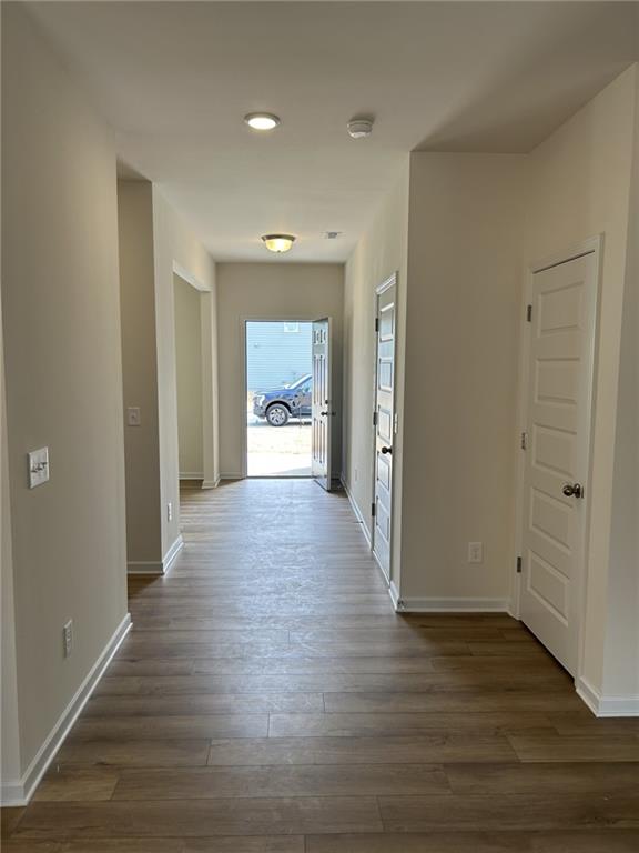 23 Whistling Oaks NE Drive Rome, GA 30165 - Photo 4 of 26 a view of an empty room with wooden floor and a window